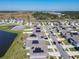 Residential neighborhood with solar panels and a community pond at 942 Jackson Ave, Davenport, FL 33837