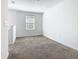 Bedroom featuring carpeted floor, window, and neutral color palette at 942 Jackson Ave, Davenport, FL 33837