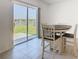 Bright breakfast nook with tile flooring, sliding glass doors to the backyard, and views of the community at 942 Jackson Ave, Davenport, FL 33837
