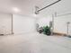 Spacious two-car garage with modern lighting and water heater at 942 Jackson Ave, Davenport, FL 33837