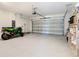 Spacious two-car garage with epoxy flooring and ample storage space at 942 Jackson Ave, Davenport, FL 33837