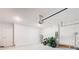 Spacious garage featuring a motorcycle, ample lighting, and a clean, sealed floor at 942 Jackson Ave, Davenport, FL 33837