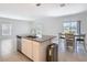 This kitchen features an island, a stainless dishwasher, and a view of the lake at 942 Jackson Ave, Davenport, FL 33837