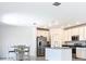 A modern kitchen with stainless steel appliances, sleek white cabinets, and ample lighting at 942 Jackson Ave, Davenport, FL 33837