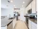 Modern kitchen featuring stainless steel appliances and white cabinetry providing a sleek design at 942 Jackson Ave, Davenport, FL 33837