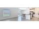 Bright living room with natural light, sleek floors, and sliding glass doors to the backyard at 942 Jackson Ave, Davenport, FL 33837