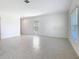 Spacious living room area with windows and tile floors at 942 Jackson Ave, Davenport, FL 33837