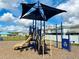 Community playground with modern play structure, slide, and overhead shade for outdoor fun at 942 Jackson Ave, Davenport, FL 33837