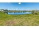 Beautiful pond with residential houses in the background at 942 Jackson Ave, Davenport, FL 33837