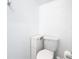 A bright toilet room with a toilet and a storage cabinet at 942 Jackson Ave, Davenport, FL 33837