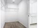 Spacious walk-in closet with wire shelving and access to additional storage space at 942 Jackson Ave, Davenport, FL 33837