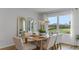 Comfortable dining area with wood table, seating for four, and natural light from a large window at 1028 Morfontaine St, Daytona Beach, FL 32124