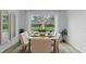 Dining area featuring a wood table, four upholstered chairs, and view to the outdoors at 1028 Morfontaine St, Daytona Beach, FL 32124