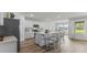 Bright, open kitchen featuring a large island, white cabinets, and stainless steel appliances at 1028 Morfontaine St, Daytona Beach, FL 32124