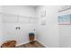 Functional laundry room with ample shelving, washer/dryer hookups, and stylish decor at 1028 Morfontaine St, Daytona Beach, FL 32124
