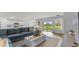 Bright and airy living room with sliding glass doors to the backyard and an open layout to the kitchen at 1028 Morfontaine St, Daytona Beach, FL 32124