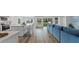 Open concept living space with views of the kitchen island, dining area, and backyard at 1028 Morfontaine St, Daytona Beach, FL 32124