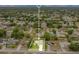 An aerial view of the house with a well-kept yard in a neighborhood, with green grass and clear skies at 1116 Adirondack St, Deltona, FL 32725