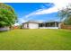 Spacious backyard featuring a screened patio, perfect for outdoor enjoyment at 1116 Adirondack St, Deltona, FL 32725