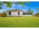 Large backyard with a screened in patio and fencing at 1116 Adirondack St, Deltona, FL 32725