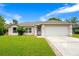 Charming single-Gathering home with a well-manicured lawn and a two-car garage in a peaceful neighborhood at 1116 Adirondack St, Deltona, FL 32725