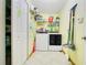 Bright laundry room with washer, dryer, and ample shelving at 1116 Adirondack St, Deltona, FL 32725