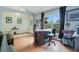 Home office with desk, chair, and arched window bringing in natural light at 1116 Adirondack St, Deltona, FL 32725