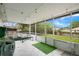 Screened patio with lights, outdoor seating and view of the backyard at 1116 Adirondack St, Deltona, FL 32725