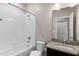 Bathroom featuring a shower/tub combo and granite counter at 11968 Sands Cv, Orlando, FL 32828