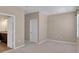 Bright bedroom featuring plush carpet and an open doorway to the Primary bath at 11968 Sands Cv, Orlando, FL 32828
