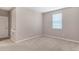 Neutral bedroom featuring plush carpet and a window at 11968 Sands Cv, Orlando, FL 32828