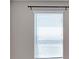 Close-up of a window with white blinds in a room with neutral walls at 11968 Sands Cv, Orlando, FL 32828