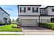 Charming two-story townhome with a two-car garage and brick-paved driveway at 11968 Sands Cv, Orlando, FL 32828