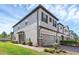 Attractive two-story townhome with a well-maintained lawn, and stone veneer accents at 11968 Sands Cv, Orlando, FL 32828