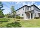 View of home exterior with screened lanai and private backyard at 11968 Sands Cv, Orlando, FL 32828