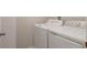 Bright laundry room with well-maintained washer and dryer units at 11968 Sands Cv, Orlando, FL 32828
