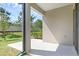 Relaxing outdoor patio area with a view of the manicured backyard at 11968 Sands Cv, Orlando, FL 32828