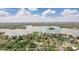 Expansive aerial view highlighting home's location near a beautiful lake at 123 Tangelo Court, Maitland, FL 32751