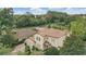 Aerial view showcasing a charming home, lush greenery, and tile roof details at 123 Tangelo Court, Maitland, FL 32751