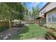 Backyard with grass, landscaping, awning covered patio, and partial view of a hot tub at 123 Tangelo Court, Maitland, FL 32751
