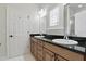 Bathroom featuring double sinks, granite countertops, and natural lighting at 123 Tangelo Court, Maitland, FL 32751