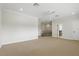 Bright bonus room with carpeted floors, crown molding, and natural light from multiple entry points at 123 Tangelo Court, Maitland, FL 32751