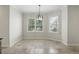 Breakfast nook with plantation shutters and a modern chandelier at 123 Tangelo Court, Maitland, FL 32751
