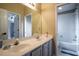 Bathroom featuring a double sink vanity with gray cabinets, and a shower-tub combo at 12618 Greco Dr, Orlando, FL 32824