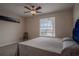 Bedroom with neutral colors, a ceiling fan, and a window with blinds at 12618 Greco Dr, Orlando, FL 32824