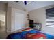 Neutral bedroom features a desk area, closet, and bright window at 12618 Greco Dr, Orlando, FL 32824
