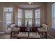 Breakfast nook with a bay window overlooking the pool area and an adjacent door to the patio at 12618 Greco Dr, Orlando, FL 32824