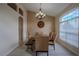 Formal dining room featuring a chandelier, accent wall and an archway leading to other living spaces at 12618 Greco Dr, Orlando, FL 32824