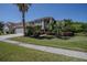 Charming two-story home with manicured lawn, three-car garage, and neatly trimmed landscaping at 12618 Greco Dr, Orlando, FL 32824