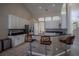 Kitchen showcasing white cabinets, granite countertops, a breakfast bar, and stainless appliances at 12618 Greco Dr, Orlando, FL 32824